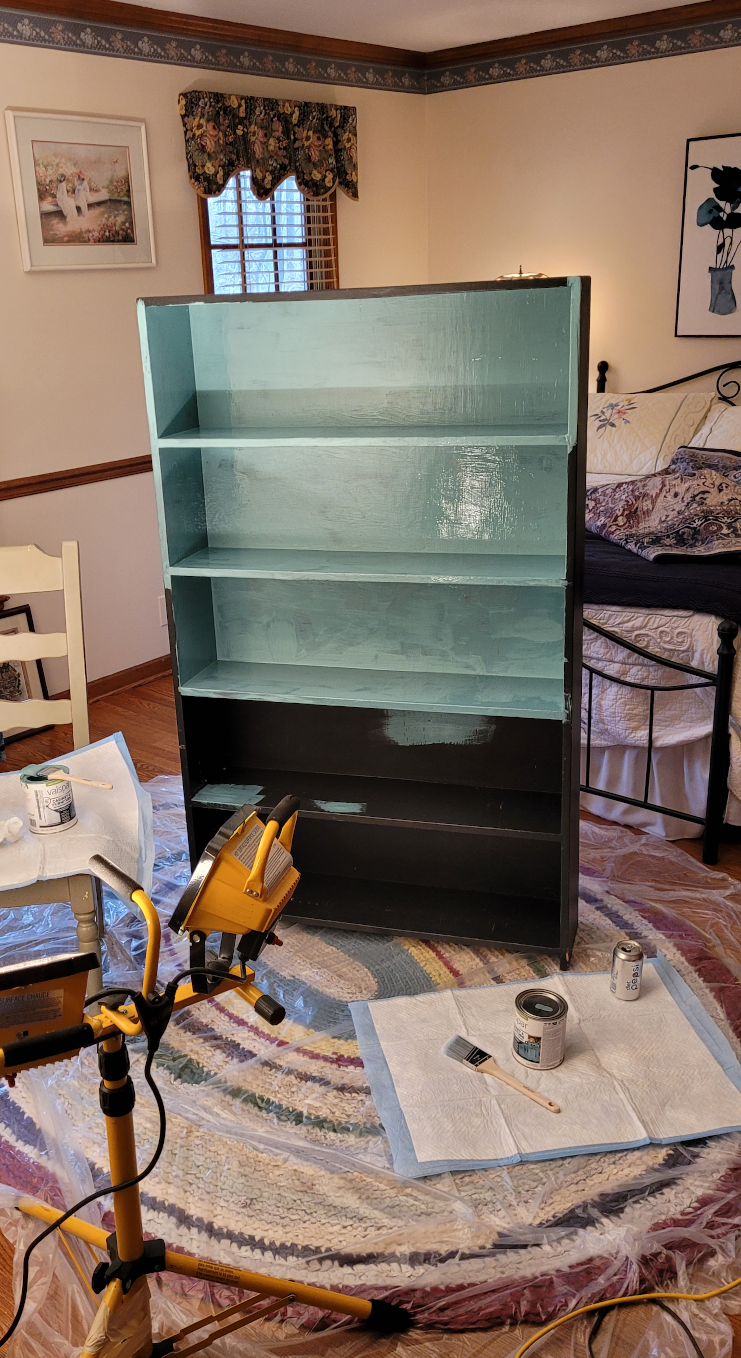 Half-painted bookcase.
