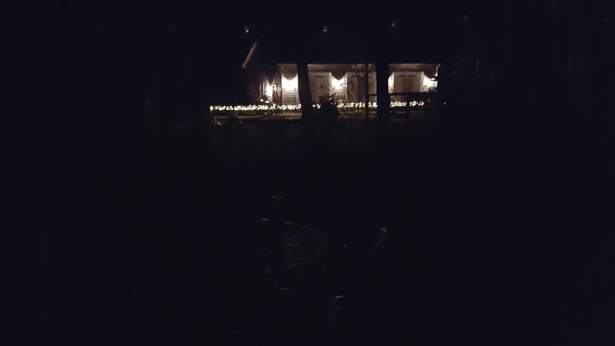Lit building in darkness.