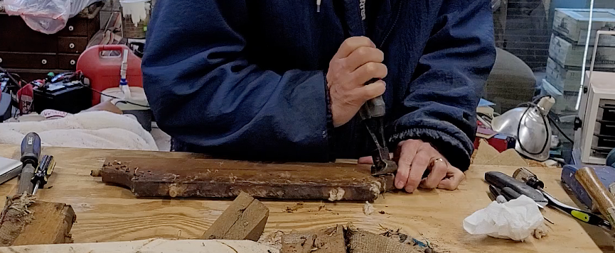 Pulling old nails.