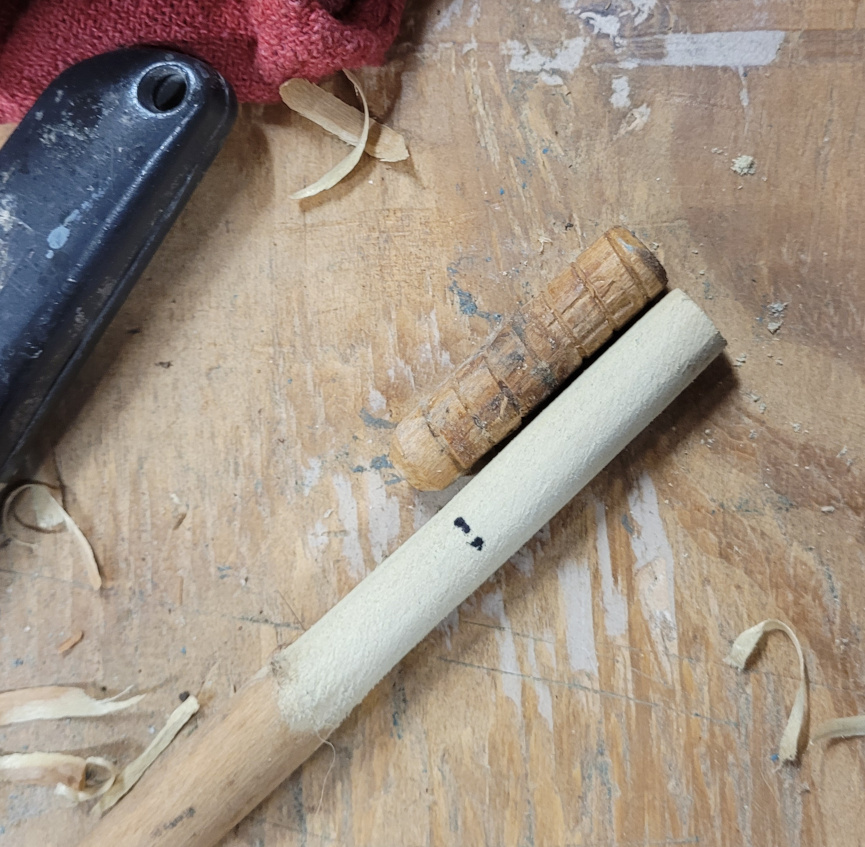 making a wood peg from a dowel.