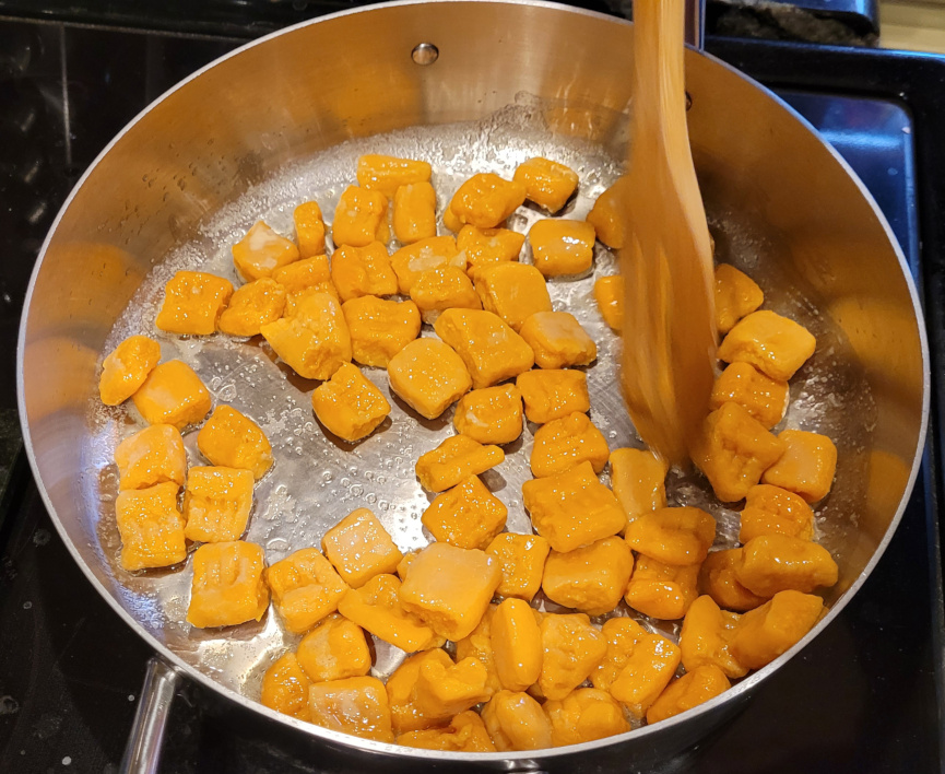 Gnocchi frying in a pan of butter