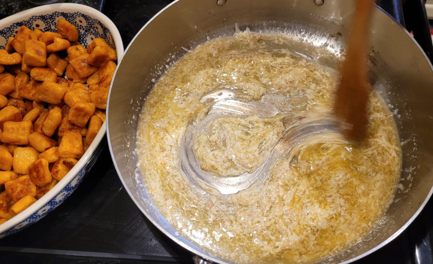 stirring sauce in pan