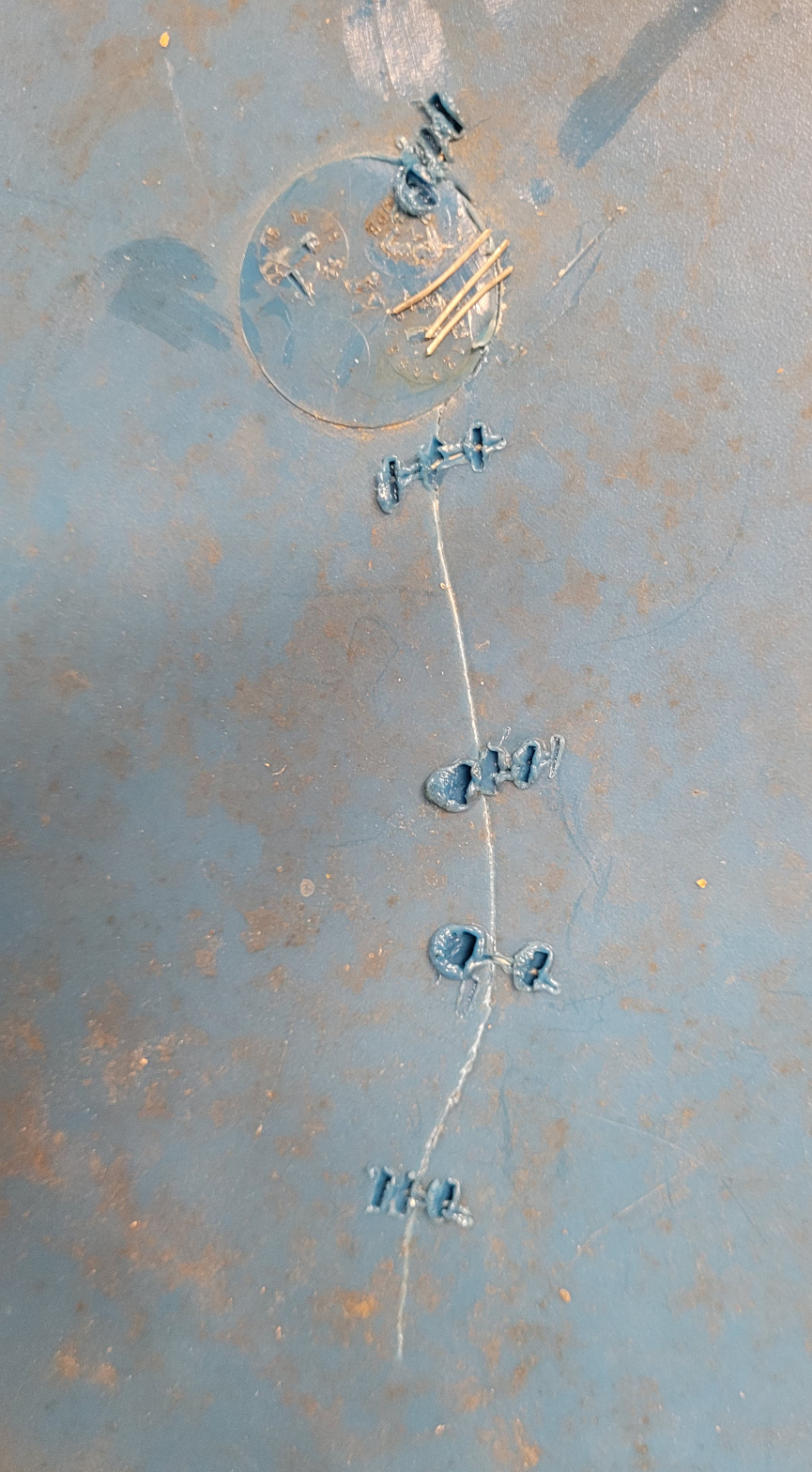 wires embedded into plastic to repair a crack