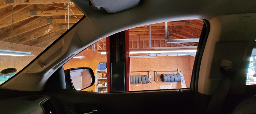 view from a truck on a lift in a garage