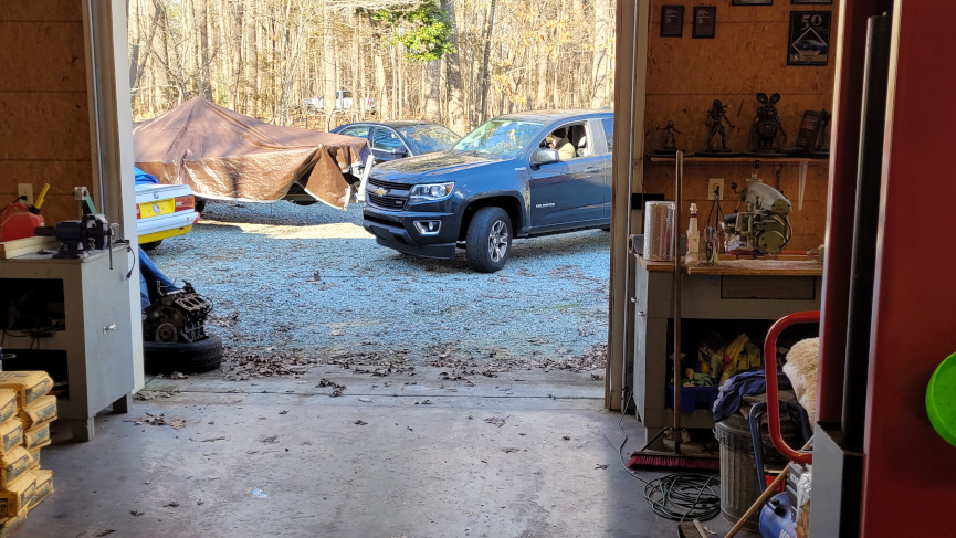 a truck backing out of a garage