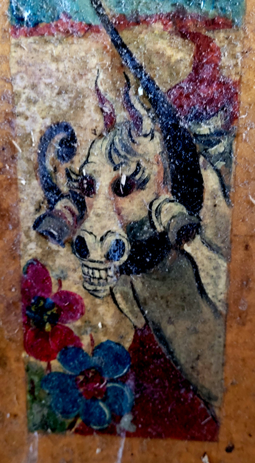 detail of a initial on a horse name plate