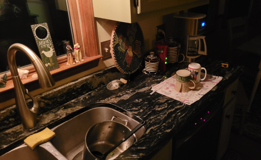 dishes in a sink, a countertop