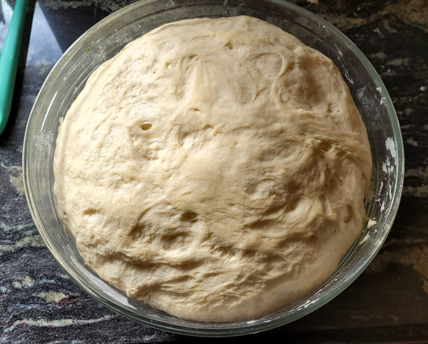 brad dough in a glass bowl
