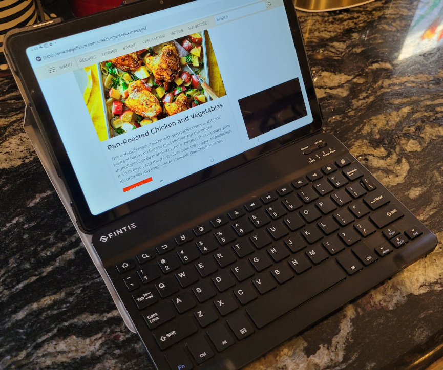 a laptop with a web browser showing a chicken recipe