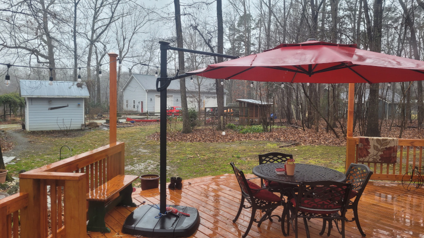 wet backyard viewed from a deck