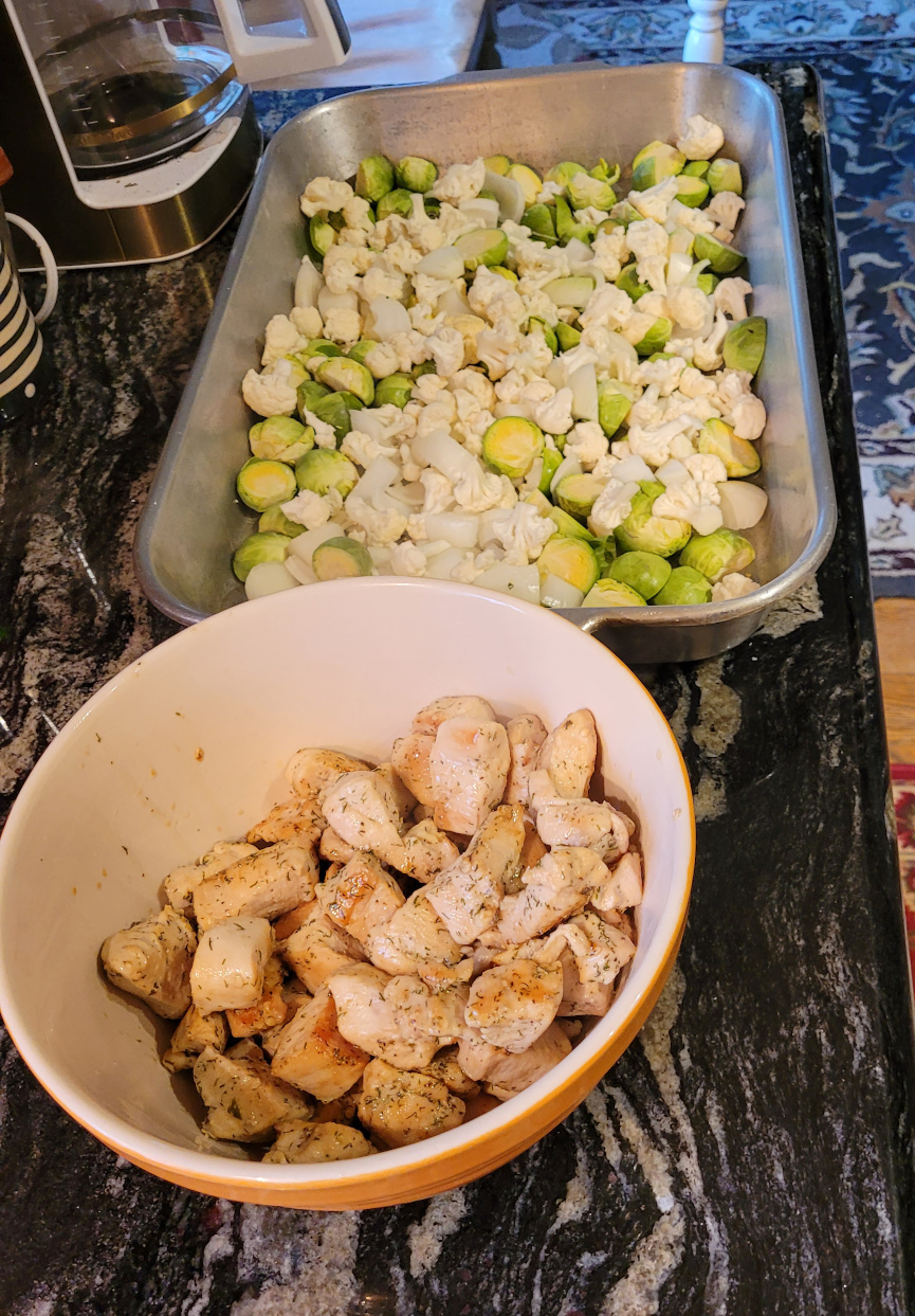 Pan of vegetables and a bowl of chicken