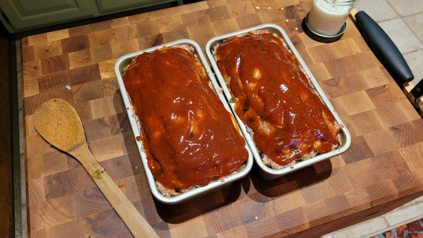 Two meatloaf pans just out of the oven