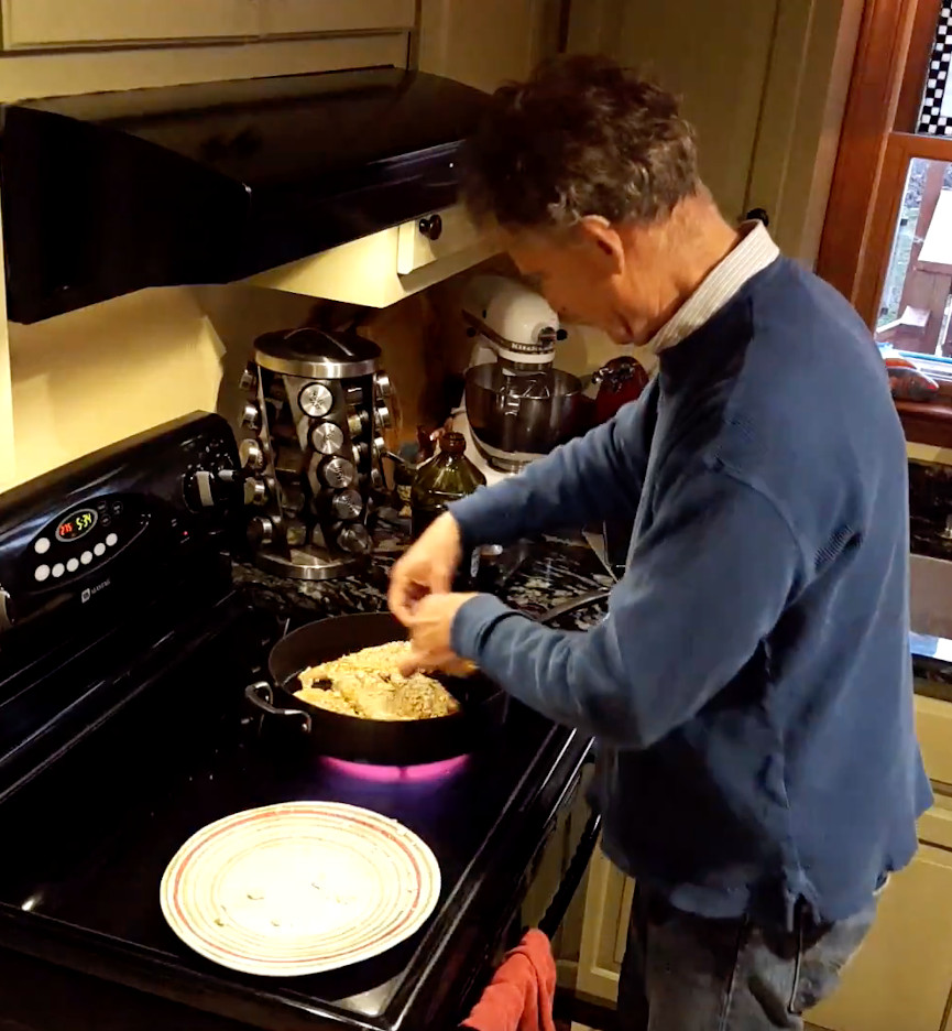 putting breaded chicken in a pan